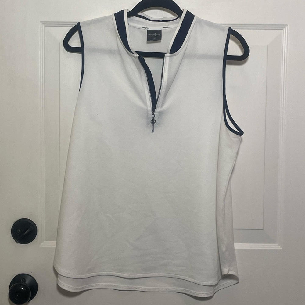 White Sleeveless Belyn Key Golf Top With Navy Trim